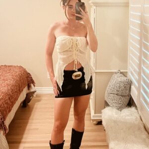 outfit with boots, chunky belt, and mini skirt